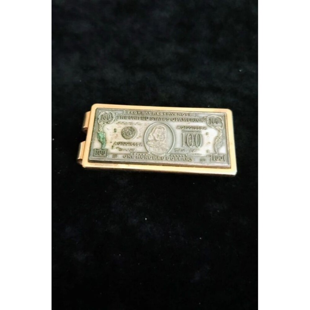 Gold and silver toned money clip